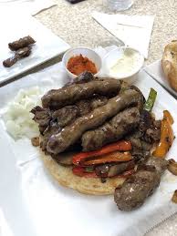 Balkan Treat Box signature dishes Cevapi (grilled beef sausages)Pide (Turkish wood-fired flatbread)Lahmacun